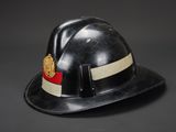 black fireman ' s hard hat with a red and white stripe