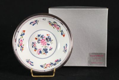 a white plate with a floral design on it