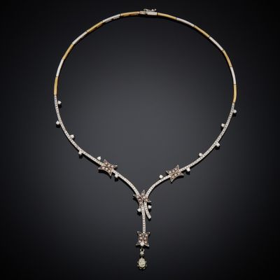 a diamond and gold necklace, by businessperson