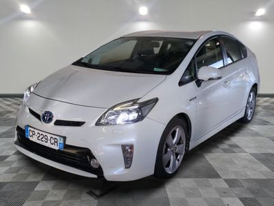 a picture of a white toyota prius parked on a checkered floor