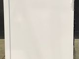 an image of a white refrigerator with a blue sticker on the door