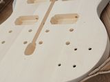 someone is making a guitar out of plywood plywood and plywood