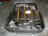 several cell phones are in a case on a table