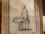framed drawing of a man sitting on a bench with a dog