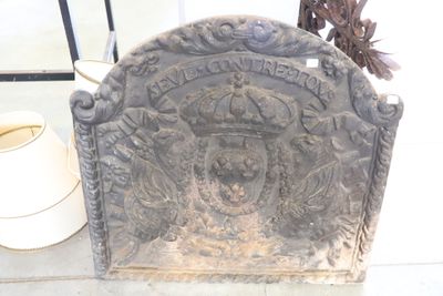 a stone plaque with a crown on top of it