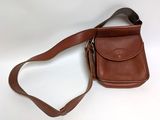 an image of a brown leather purse with a strap on it