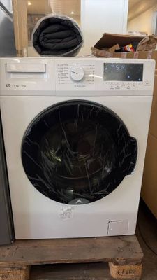 a washing machine sitting on a pallet in a room