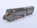 a toy train on a white surface with a white background