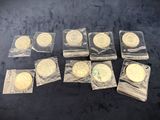 a close up of a bunch of gold coins on a table