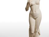 an image of a statue of a woman holding a flower in her hand