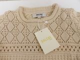 an image of a sweater with a tag hanging on it