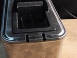 an image of a toaster sitting on a wooden table