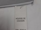 a label on a bed sheet that says housse de cousssin