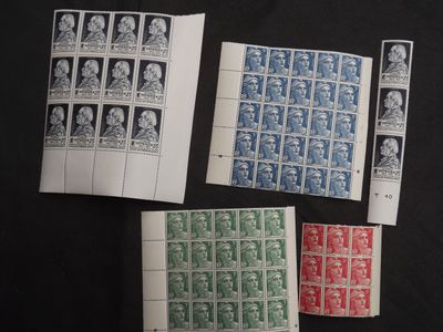 four different types of stamps on a black surface
