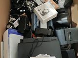 a cardboard box filled with electronic equipment and other items