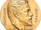a close up of a gold medal with a man ' s face on it