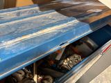a surfboard that is sitting in a blue box