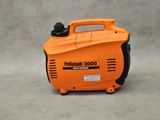 a close up of an orange and black portable generator on a gray background
