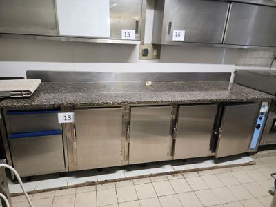 a kitchen with stainless steel cabinets and a counter top