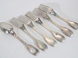 six forks and spoons are lined up on a white surface