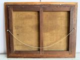 an old wooden frame with a rope hanging from it ' s side