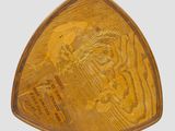 an old wooden triangle shaped object with a picture of a man on it