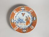 an orange and white plate with a picture of a man on it