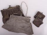 a purse and a pair of gloves sitting on a table