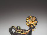 a black vase with a yellow and green design on it