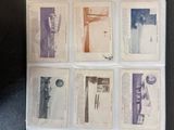 six different types of old postcards on a black surface