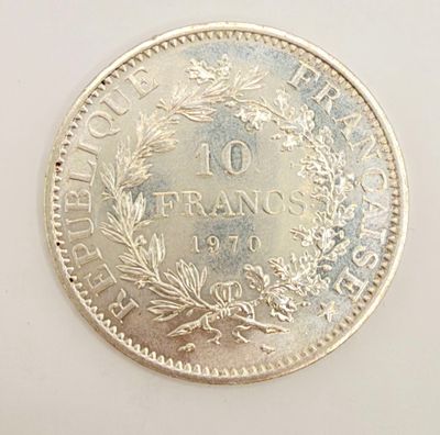 a close up of a coin on a table with a white background