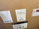 a cardboard box with some stickers on it sitting on the floor