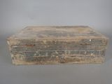 an old wooden box sitting on top of a table