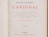 an old book opened to show the title of a novel