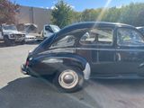 a black car that is parked in a parking lot
