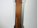 a tall wooden pole in a room with tile flooring