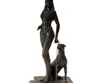 bronze statue of a woman with a dog on a marble base
