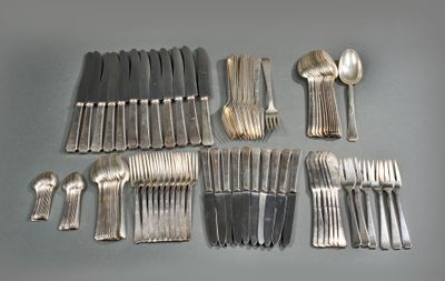 many forks and spoons laid out on the table