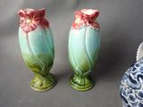 two vases that are sitting next to each other on a table
