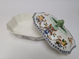 a white plate with a blue and green design on it