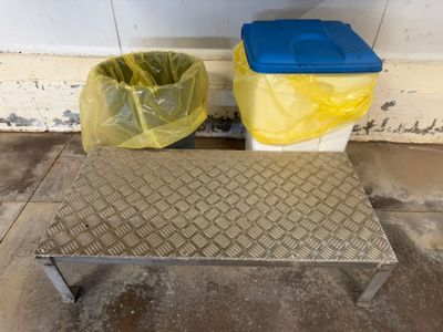 a trash can and a trash can sitting on the floor