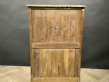 an old wooden cabinet with a door on top of it