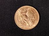 a close up of a coin with a rooster on it