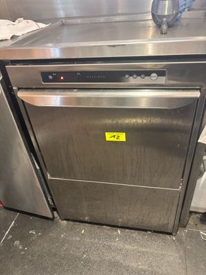 an image of a stainless steel dishwasher sitting on top of a counter