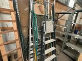 a ladder that is leaning against a wall in a warehouse