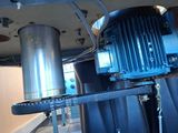 an image of a machine that is working on a piece of metal