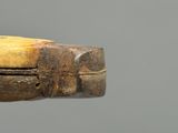 a close up of a wooden stick with a handle