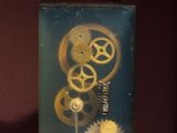 a picture of a clock with gears inside of it