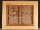 a close up of a wooden frame with a picture on it