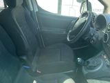 the interior of a small car with black seats and a steering wheel